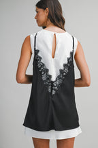 Woman wearing sleeveless mini dress with black lace overlay and back keyhole button closure in women's clothing.