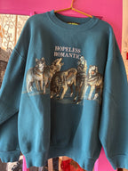 Blue women's sweatshirt with wolf illustration and "HOPELESS ROMANTIC" text on front, casual fashion apparel