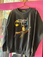 Black sweatshirt with bold graphic of a superhero and the words "HOPELESS ROMANTIC" on front in women's clothing style