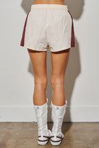 Women's white and burgundy colorblock shorts with elastic waist