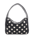 Black faux leather women's handbag with silver circular studs and a single strap handle