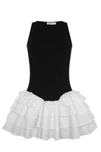 Black sleeveless bodice dress with layered white ruffled mini skirt for women's clothing.