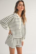 Woman wearing a casual striped top and matching shorts in soft cotton, styled for women's clothing.