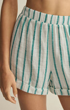 Close-up of women's striped fabric shorts with an elastic waistband in casual style