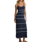 Woman wearing a navy blue and white striped maxi dress with thin straps, styled for casual women's clothing.