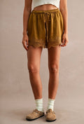 Women’s lace-trimmed shorts with adjustable drawstring and elastic waistband in a relaxed fit style