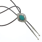 Black cord bolo tie with silver decorative clasp and turquoise stone centerpiece for women's fashion accessory