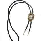 Black bolo tie with an ornate vintage-style clasp featuring a bird design for women's fashion accessories