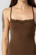 Close-up of a woman wearing a brown ribbed tank top with lace detail and adjustable straps in women's clothing.