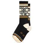 Black crew socks with white and mustard stripes and bold contrasting text design, cotton blend, women’s apparel accessory.
