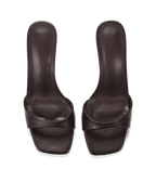 Pair of women's dark brown leather open-toe mules with a low heel, minimalistic and stylish footwear design.