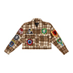 Cropped brown plaid women's shacket with multiple colorful patches on sleeves and chest pockets