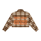 Brown and cream plaid cropped shacket with orange text "FIRST ROW DEFEND YOUR RIGHTS" on the back for women's clothing.