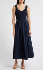 Sleeveless navy midi dress with ribbed bodice and cotton skirt featuring subtle eyelet details for women's clothing.