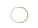 Stretch bracelet with alternating gold and silver beads, handmade accessory for women's fashion.
