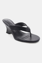Black women's wedge sandal with thong strap and square toe design on white background