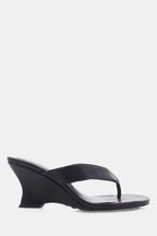 Black wedge sandal with thong strap, sleek design for women's casual or dressy occasions