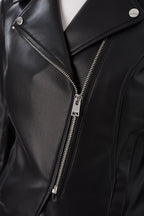 Close-up of a fitted black leather moto jacket with silver diagonal zipper and snap collar for women's clothing.