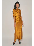 Woman wearing gold satin maxi dress with asymmetrical neckline and single cap sleeve in a studio setting