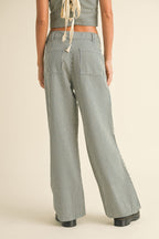 Back view of women's striped wide-leg pants in cotton blend fabric with patch pockets and a casual fit.