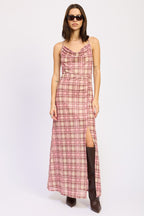 Woman wearing a sleeveless pink plaid maxi dress with a side slit and sunglasses in women's clothing fashion style