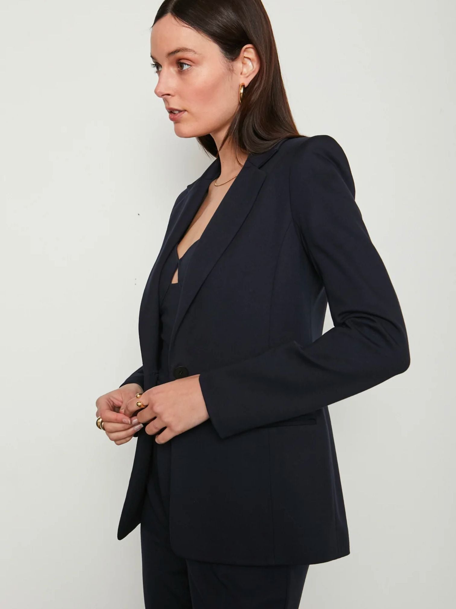 Woman wearing navy blue blazer opened