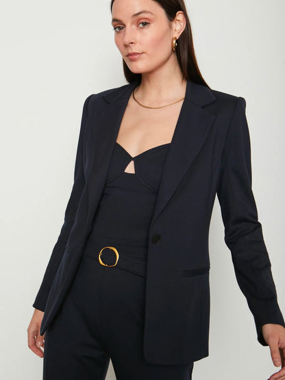 Woman wearing navy blue blazer opened