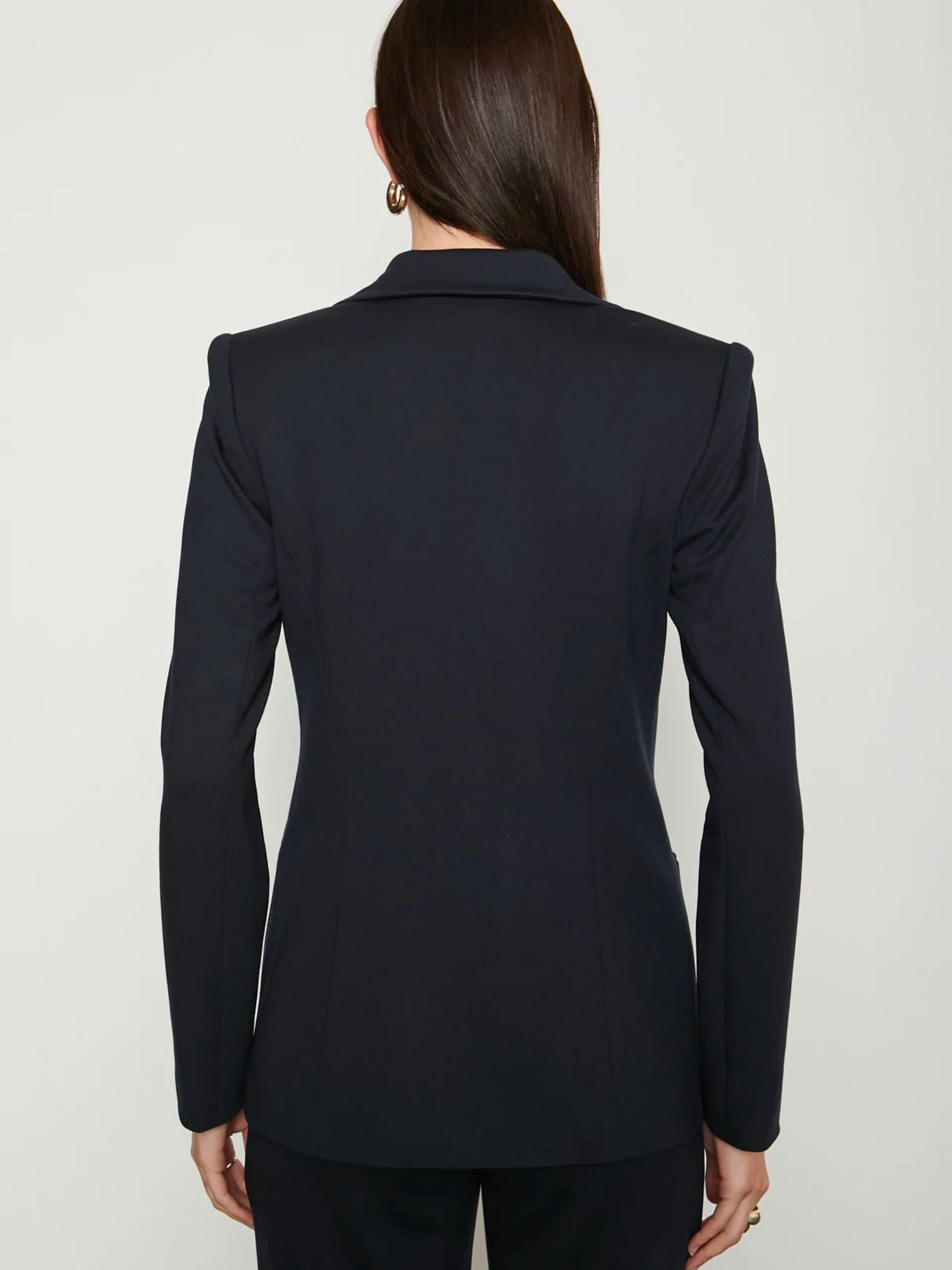 Woman wearing navy blue blazer opened