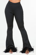 Women's high-waist black flare pants with marabou fur trim at the hem, made from stretchy poly spandex fabric